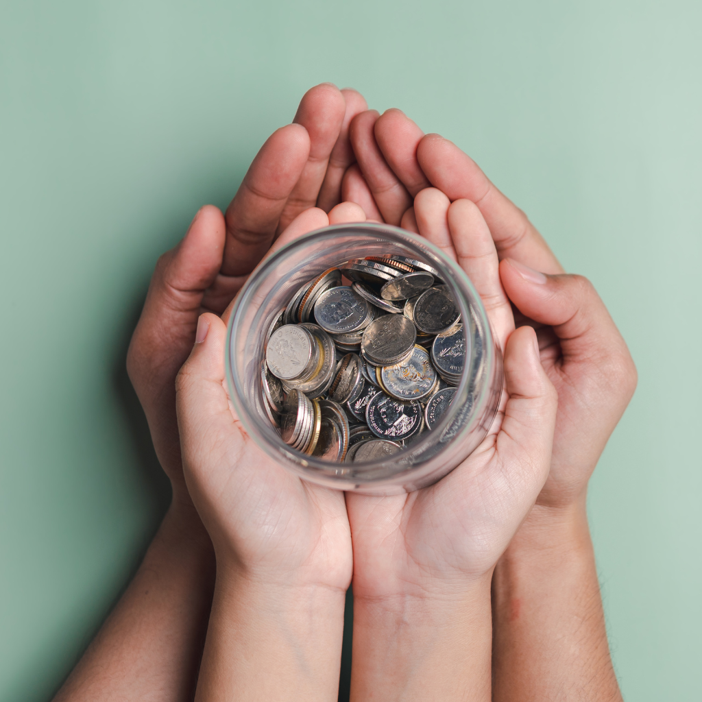 Hands holding a money box